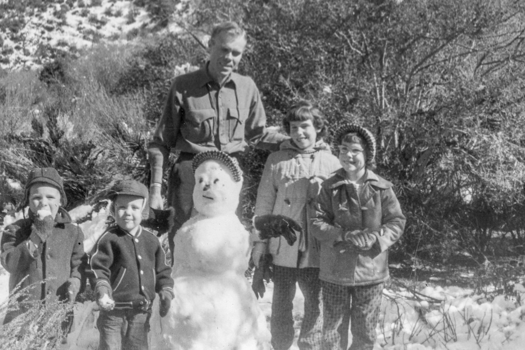 Mike, Pat, Dad, snowman, Mary, Esther. Our first time seeing snow!