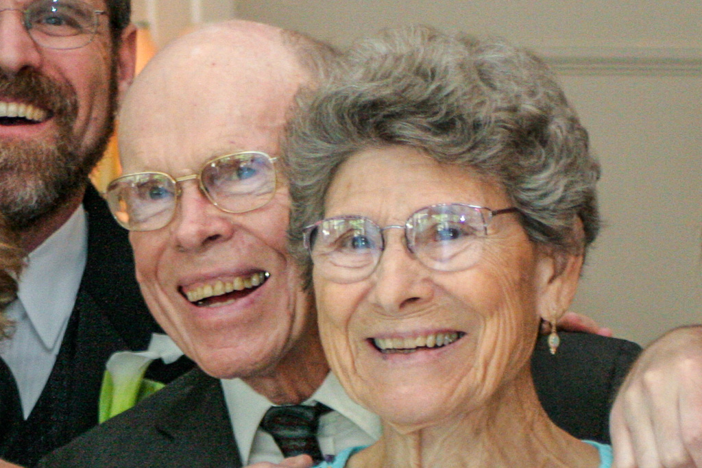 Jesse and Kendall's wedding reception smiles.