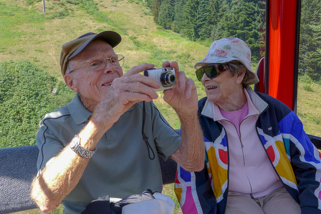 2013 — Dad and Mom heading up the gondola at Crystal Mt